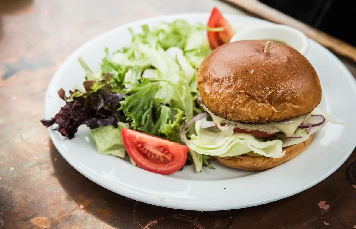 Pub burger served with fresh salad